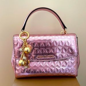 Pink Michael Kors handbag with gold keychain